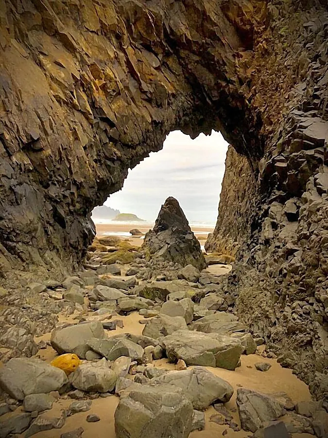 Natural rock arch on Arch Cape Beach